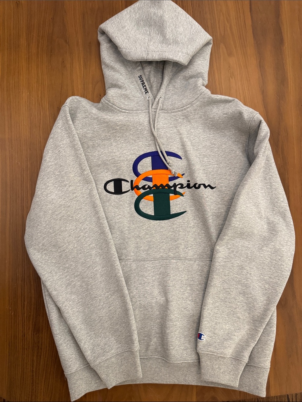 Supreme Champion Gray Hoodie with Multicolor Chest Logo